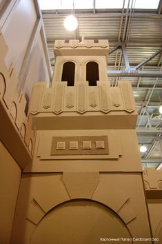 a tall clock tower sitting inside of a building