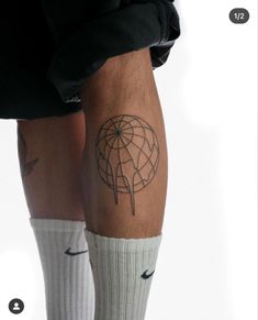 a man with a tattoo on his leg