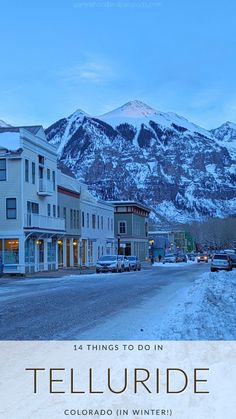 a town with mountains in the background and text that reads telluride colorado in winter