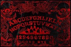 an old black and red book with the letters in gothic font on it, surrounded by ornate designs