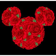 red roses are arranged in the shape of mickey mouse's head on a black background