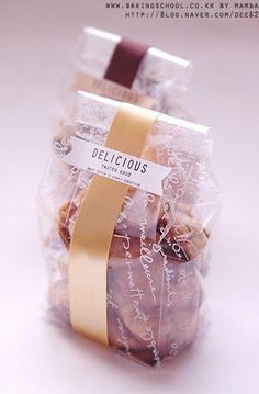 a bag filled with cookies wrapped in cellophane on top of a white table