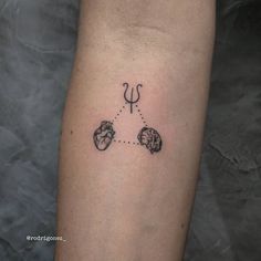 a person with a tattoo on their arm that is connected to the heart and arrow