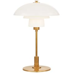 a white and gold lamp on a stand