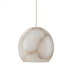 a white marble ornament hanging from a cord