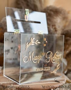 an acrylic box that says maggo's room on it