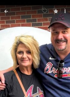 a man and woman posing for a photo