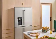 a kitchen with wooden cabinets and stainless steel appliances