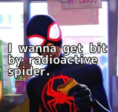 a man in a spider suit holding a hot dog and wearing glasses with the caption i wanna get bit by radioactivetive spider