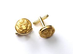 This cufflink set bears authentic United States Army uniform buttons set on your choice of gold-tone or silver-tone cufflink hardware. Each button was manufactured by the Waterbury Button Company, the official supplier of the United States Military. This set will be hand-crafted to order by a military spouse at Hope Design Ltd.Ⓡ. Cufflink measurements: 5/8 x 5/8 x 3/4" United States Army Uniform, Gold Cuff Links, Hope Design, United States Military, Indian Jewelry Sets, Army Uniform, Military Spouse, Gold Cufflinks, West Point