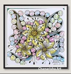 an art work with flowers and bubbles on white paper, framed in black wood frame