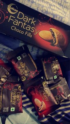 dark fantasy chocolate bars are on the bed