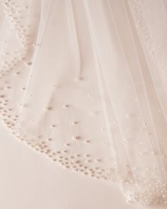 wedding veil with beading and pearls on it