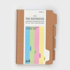 the tab notebook is made out of cardboard and has colorful notes attached to each side