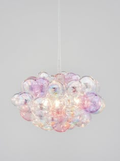 a chandelier made out of bubble balls hanging from the ceiling