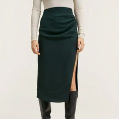 Nwt Mango Vent Midi Skirt. Recycled Polyester Blend Fabric. Very Dark Green - Hard To Tell On My Photos, But The Stock Photo Is Spot On. Straight Midi With High Side Slit. Gathered Detail With Front Drape. Zip Fastening In Back. High Waist. Measurements Approximate And Layed Flat - Waist 18.5 Inches, Hips 22.5, Length 24 Inches. Dark Green Skirt, Midi Jean Skirt, Tweed Midi Skirt, Mango Skirts, Very Dark Green, Sweater Skirt Set, Polka Dot Midi Skirt, Faux Leather Pencil Skirt, Ribbed Skirt