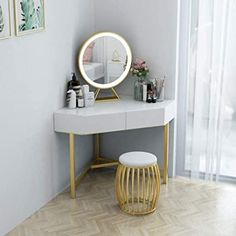 a white vanity with a mirror and stool