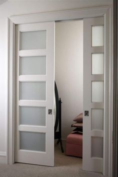 an open white door in a room