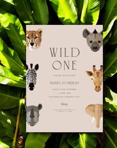 an animal themed birthday party with wild one on it's card and jungle leaves