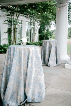 the table is covered with blue and white linens