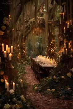 an outdoor dining area with candles and flowers on the table, surrounded by greenery