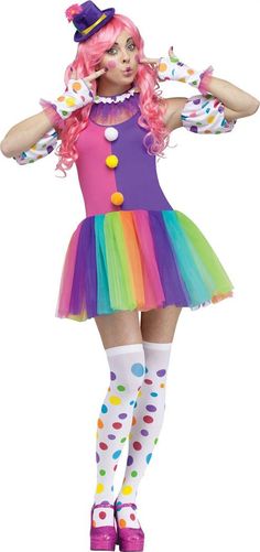 a woman dressed as a clown with pink hair and polka dots on her dress is posing for the camera