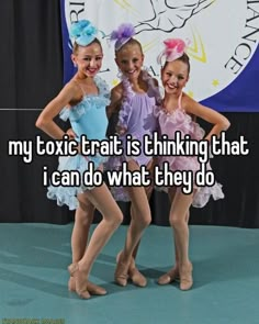 three girls in leotards posing for the camera with their arms around each other