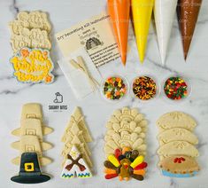 the cookies are decorated like thanksgiving turkeys and candy cornucrasies, including carrots