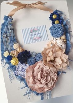 a blue and pink wreath with flowers on it