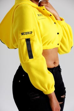 "Who wouldn't want a cute, bright yellow hoodie in their wardrobe? Take this top to the streets and you'll have everybody's eyes on you! This hoodie is crafted with soft fleece fabric, embellished with nylon zippers and straps, also designed with a cargo pocket on the sleeve with NCDRIP branding. -All of our garments are individually handmade once order is successful. *Garments are fit to size *If your measurements for your size is a little different than the standard sizing, we can make a custo Affordable Yellow Hip Hop Tops, Cheap Yellow Outerwear For Streetwear, Cheap Yellow Hoodie, Cheap Yellow Hip Hop Tops, Cheap Sporty Yellow Shirt, Cheap Neon Yellow Tops For Women, Cheap Yellow Sweatshirt With Drawstring Hood, Cheap Urban Hoodie Tops, Cheap Yellow Hooded Top