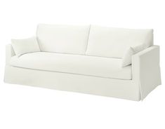 a white couch with two pillows on it