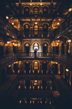 the inside of an old building lit up at night