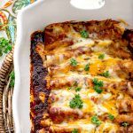 a casserole dish with meat, cheese and vegetables