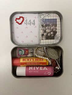 two tins filled with different types of items