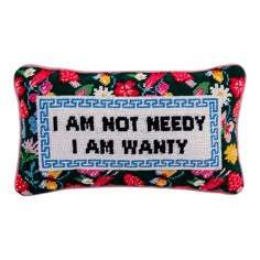 a cross stitch pillow that says i am not needy, i am wanty