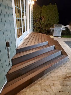 a set of wooden steps leading up to a door