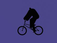 the silhouette of a man riding a bike on a purple background with space for text