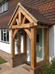 an outside view of a house with a wooden gazebo