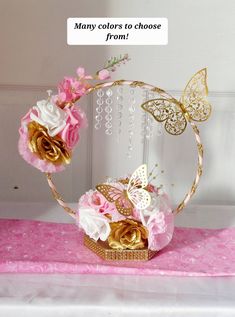 there is a pink and gold flower crown on top of a table with a sign that says, many colors to choose from