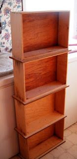 a wooden shelf sitting next to a window in a kitchen