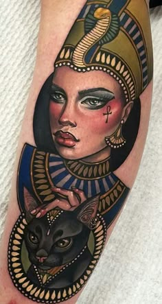 an egyptian woman with a black cat tattoo on her leg, done by the artist