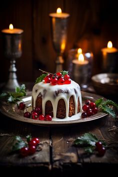 a cake with icing and cherries is on a plate next to two candles