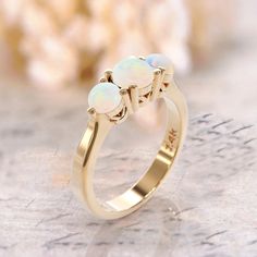 14k 3 opal ring art deco opal engagement ring gold white opal ring Rose Gold Ring October Birthstone opal jewelry minimalist promise ring gift ► FEATURES; Gemstones: natural 3 opal : 5mm ,2x3mm Material options: 14k rose gold, 14k yellow gold, 14k white gold Size: all ring sizes are available How to Order: Please select your preferred size and material from the menu while adding to cart. We pride ourselves to offer customization of almost any shape and style of a ring. If you desire a specific m Classic Opal Birthstone Jewelry, Classic Opal Moonstone Anniversary Ring, Classic Moonstone Opal Ring For Anniversary, Classic Opal Rings With Birthstone, Elegant Gold Opal Ring, Elegant 14k Gold Opal Ring For Formal Occasions, 14k White Gold Opal Ring As A Gift, Formal Opal Birthstone Ring, Elegant Ethiopian Opal Ring For Anniversary