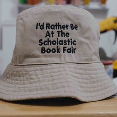 a hat that says i'd rather be at the scholastic book fair