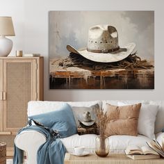 a living room filled with furniture and a painting on the wall above it's head