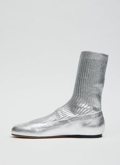 First introduced on our Spring 2024 Runway, the Borg Sock Boot receives a refresh for the turnover of seasons. Now available in two metallic colorways, our newest iteration will be the style you reach for, dialing up or toning down your look, depending on the desired vibe this Winter season. 100% Lamb Leather (Upper), 100% Cotton (Sock), 100% Cuoio Leather (Outsole) Style Number: SW24BO2118 Available in: Gold, Silver Metallic Socks, The Borg, 2024 Runway, Sock Boot, Silver Shoes, Shoes Outlet, Spring 2024, Slim Pants, Shoes Heels Boots