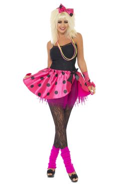 a woman in a pink and black costume with polka dots on the skirt, tights and heels