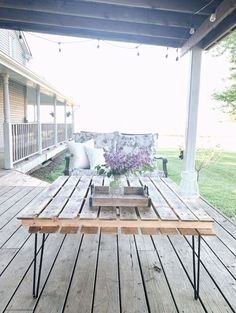 a table sitting on top of a wooden deck