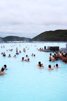 many people are swimming in the blue lagoon