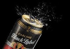 a can of black label beer is exploding